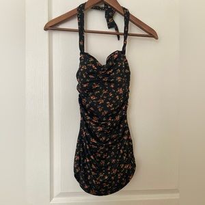 Vintage look bathing suit with slimming panel, tummy cover and padded bra.